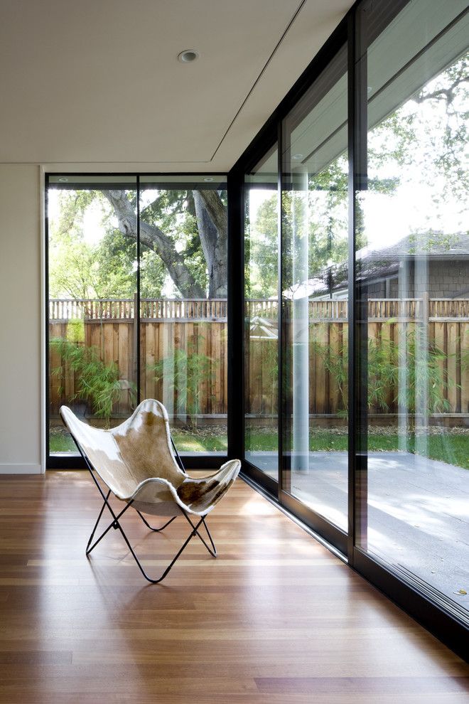 Fleetwood Doors for a Contemporary Living Room with a Butterfly Chair and Addition/remodel of Historic House in Palo Alto by Cathy Schwabe Architecture