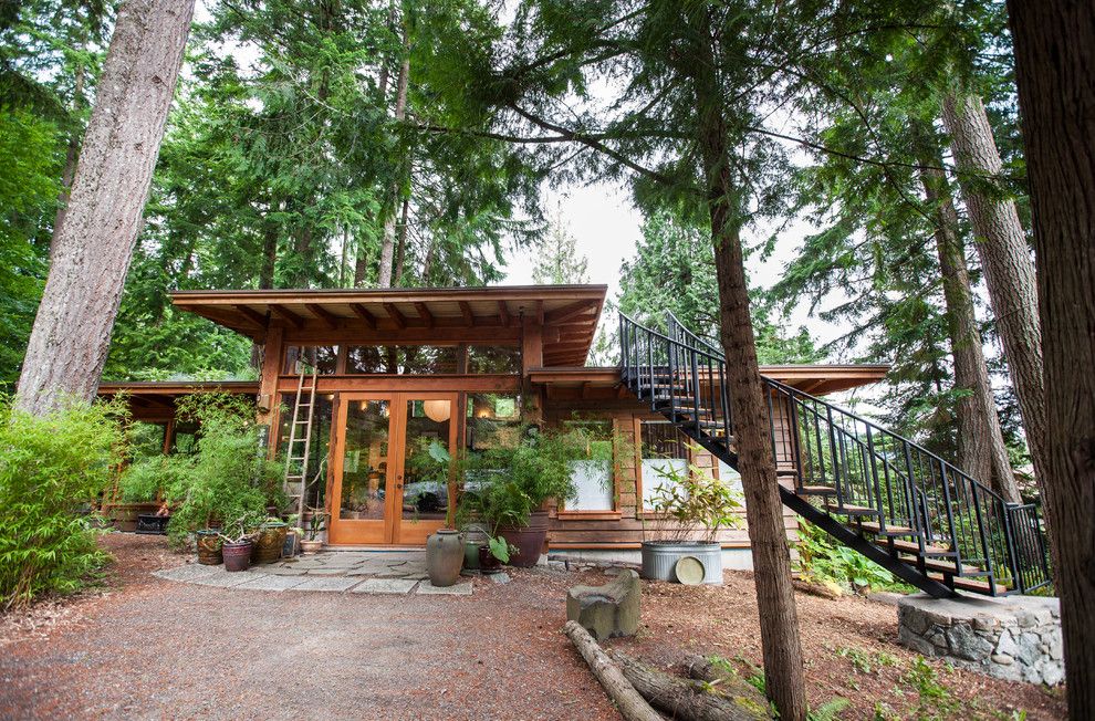 Frank Lloyd Wright Home and Studio for a Rustic Exterior with a Pine Trees and David Coulson Design Studio by David Coulson Design Ltd.