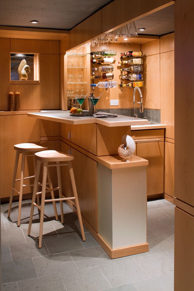 Fry Reglet for a Midcentury Basement with a Goose Neck Faucet and Lower Level Living by Princeton Design Collaborative