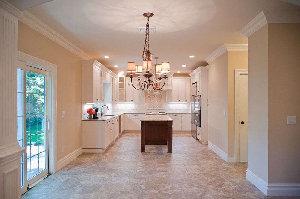 Fuda Tile for a Traditional Kitchen with a Ivory Cabinets and Woodland Estate by Elayan Construction Services