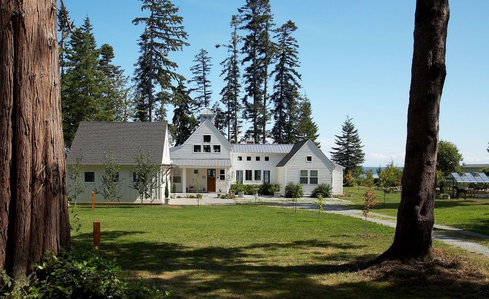 Gable Roof for a Transitional Exterior with a Cupola and View From Road. by Dan Nelson, Designs Northwest Architects