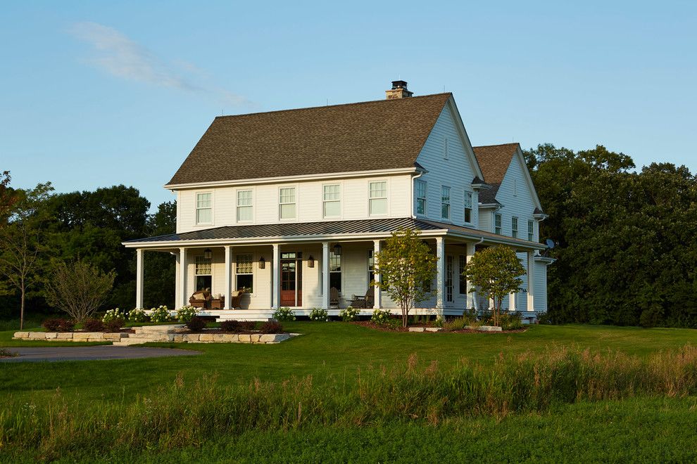 Gabled Roof for a Farmhouse Exterior with a Covered Porch and Modern Farmhouse by Hendel Homes