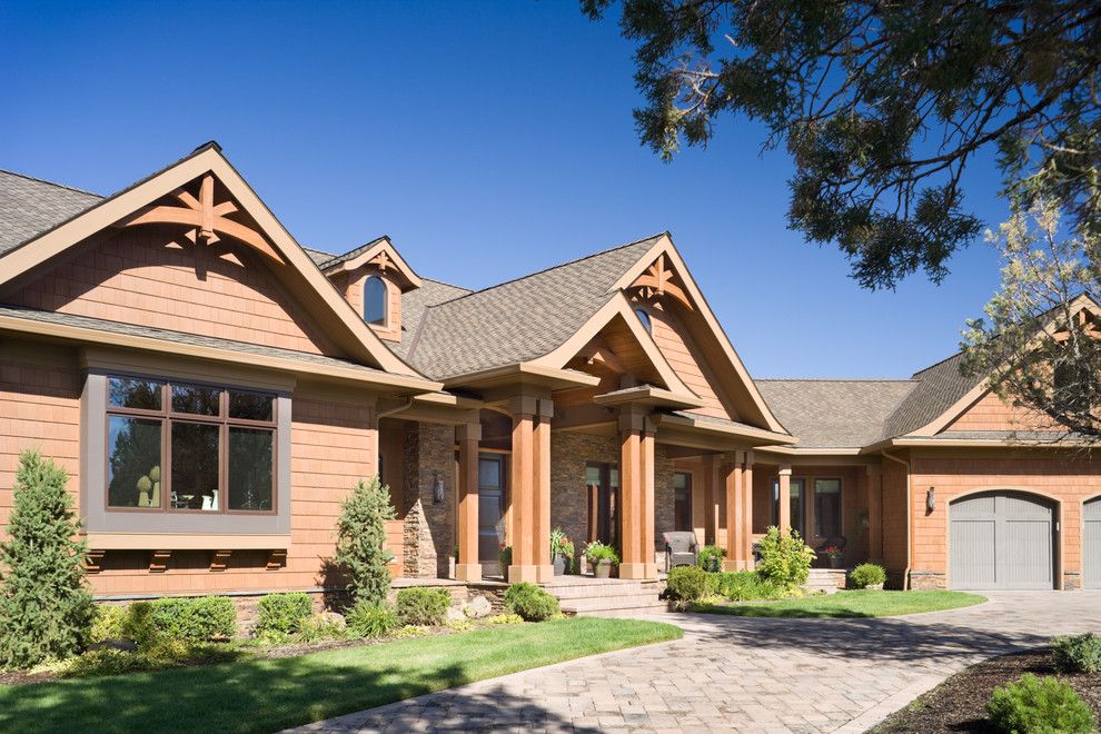 Gabled Roof for a Rustic Exterior with a Lawn and True Residence by Alan Mascord Design Associates Inc