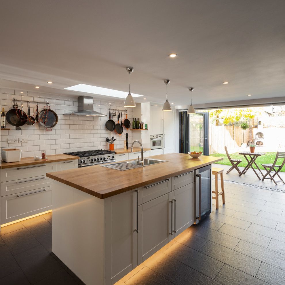 Galley Kitchen for a Transitional Kitchen with a Pan Rails and Cleaveland Road by Dblo Associates Architects