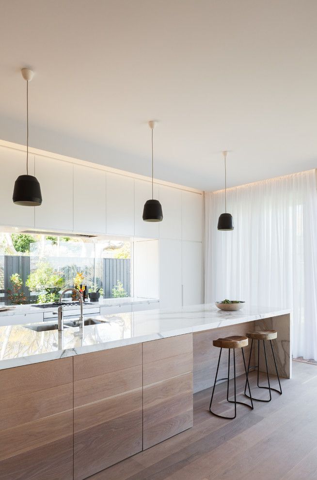 Galley Kitchen Ideas for a Scandinavian Kitchen with a Black Pendant Lights and Lennox Street House by Corben Architects