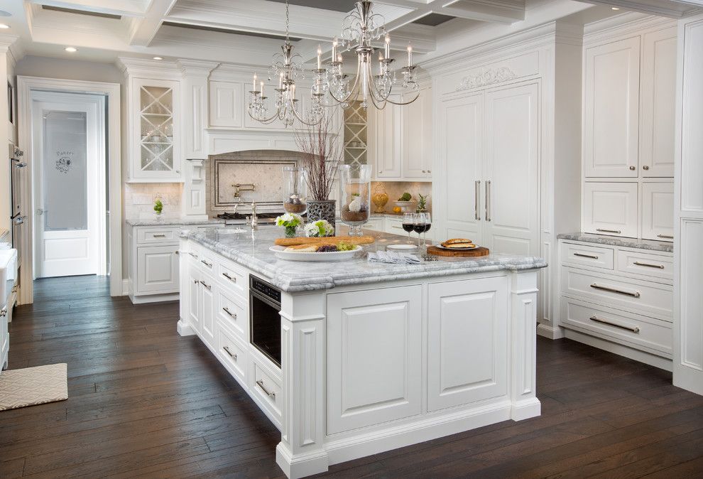 Galley Kitchen Ideas for a Traditional Kitchen with a Stainless Steel Appliances and Traditional White Kitchen with Hallmark Floors by Kichen Kraft Inc by Hallmark Floors