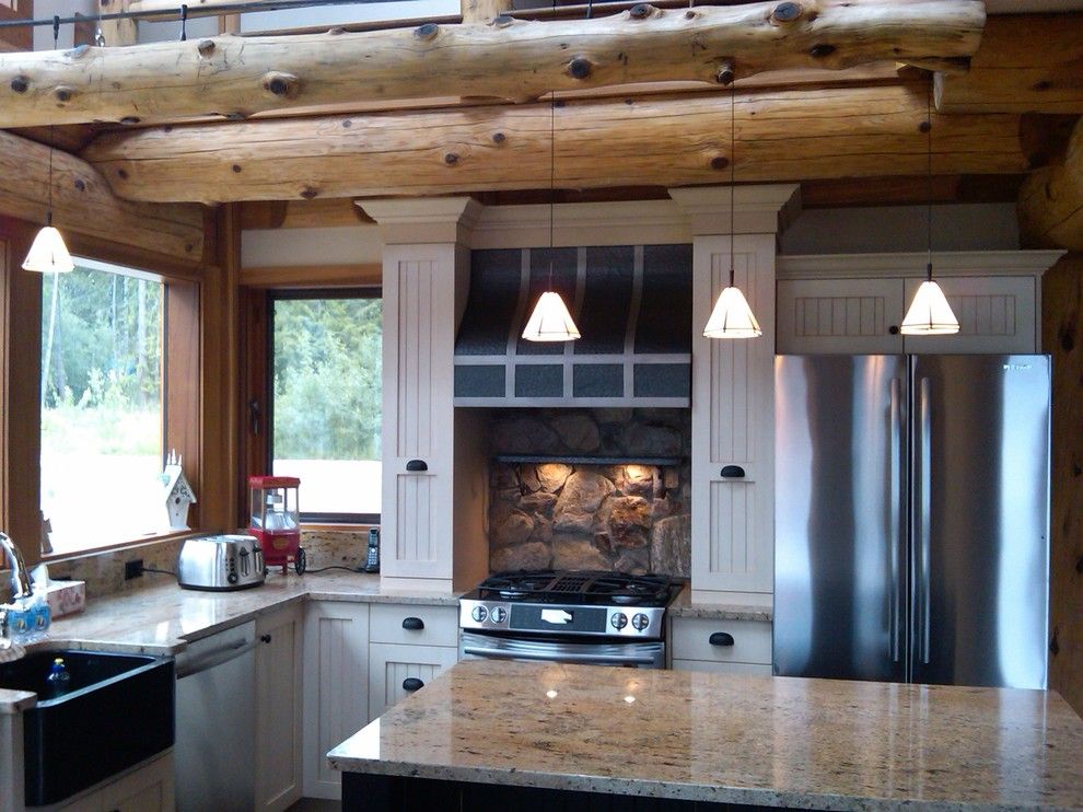 Gastineau Log Homes for a Rustic Kitchen with a Pendant Lights and Kitchen Ideas for Log Homes by Traditional Log Homes Ltd