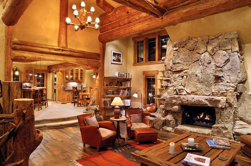 Gastineau Log Homes for a Traditional Living Room with a Stone Fireplace and Hybrid Log House by Sitka Log Homes