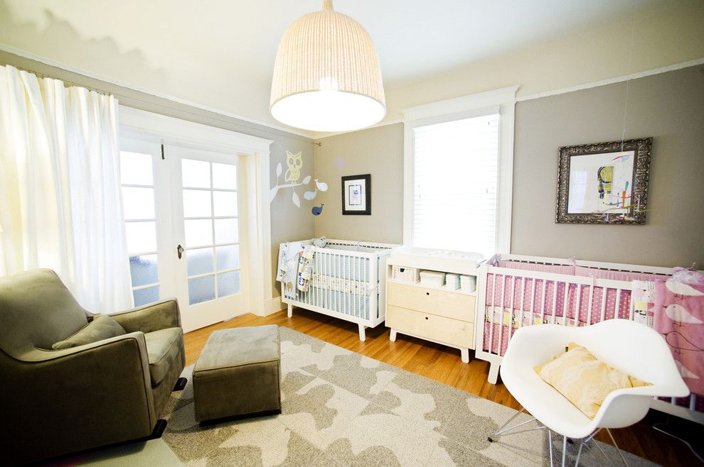 Gender Neutral Nursery for a Eclectic Nursery with a Wood Floor and Modern Nursery by Regan Baker Design