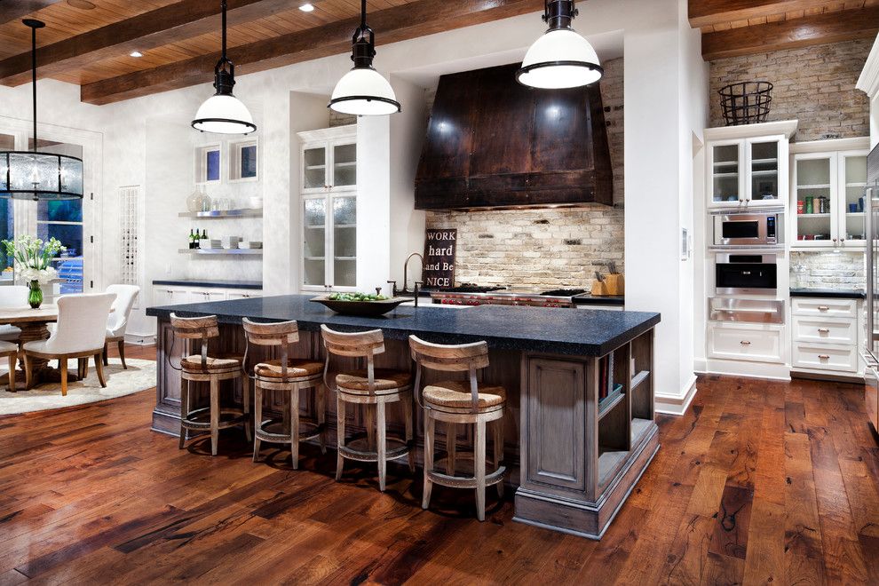 General Shale Brick for a Traditional Kitchen with a Large Vent Hood and Lake Austin by Luis Jauregui