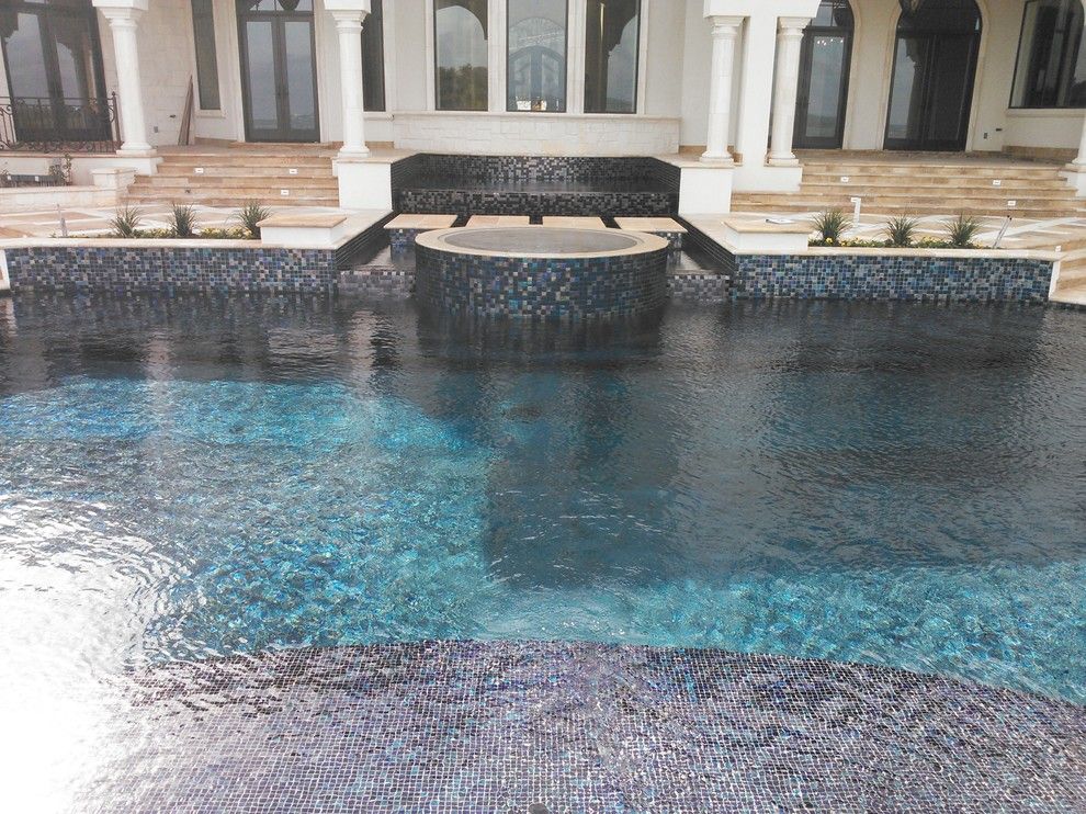 Gold Medal Pools for a Contemporary Pool with a Beach Step and Large All Tile Pool by Ocean Quest Pools by Lew Akins