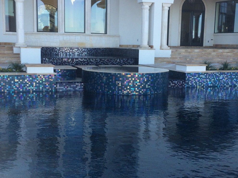 Gold Medal Pools for a Contemporary Pool with a Glass Tile and Large All Tile Pool by Ocean Quest Pools by Lew Akins