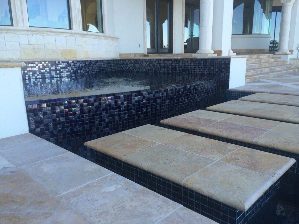 Gold Medal Pools for a Contemporary Pool with a Sun Shelf and Large All Tile Pool by Ocean Quest Pools by Lew Akins