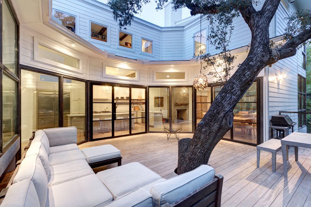 Gonzalez Furniture for a Transitional Deck with a Tree in Patio and Bouldin Creek Residence by Restructure Studio