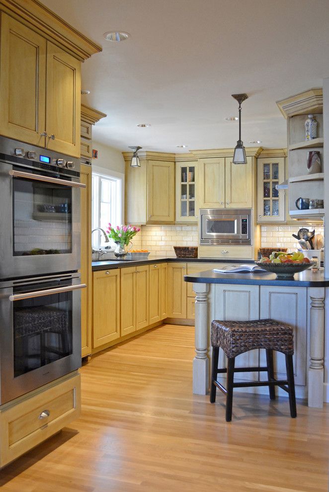 Gothic Cabinet for a Traditional Kitchen with a Double Oven and 1920s Tudor Bungalow Kitchen by Brian Dittmar Design, Inc.