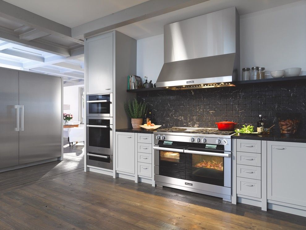 Graber Post Buildings for a Contemporary Kitchen with a Black Backsplash and Miele by Miele Appliance Inc