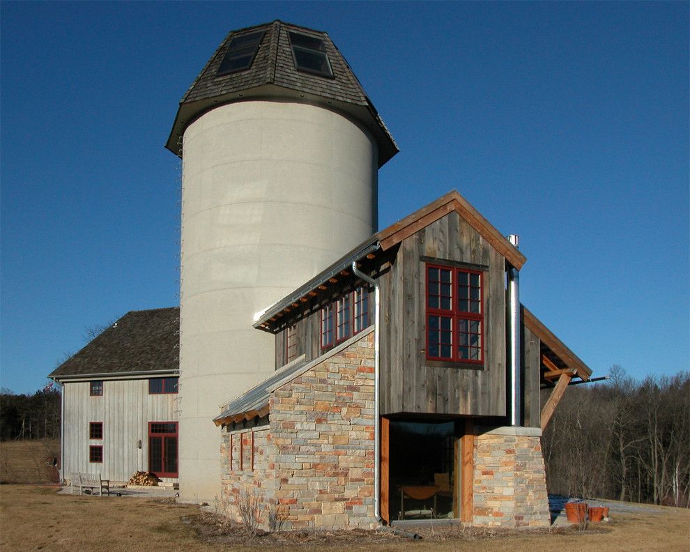 Grain Silo Homes for a Farmhouse Exterior with a Stone Facade and Barnhouse Addition by Gmk Architecture Inc