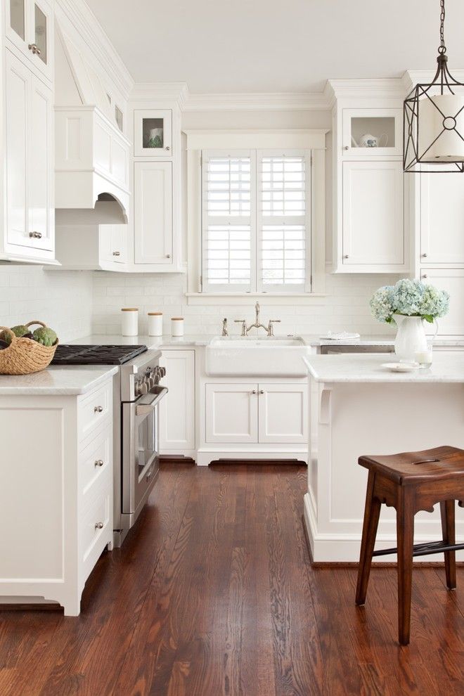 Greenfront Furniture for a Traditional Kitchen with a Farm Sink and Recent Kitchen Renovations by Carnes Home Builders