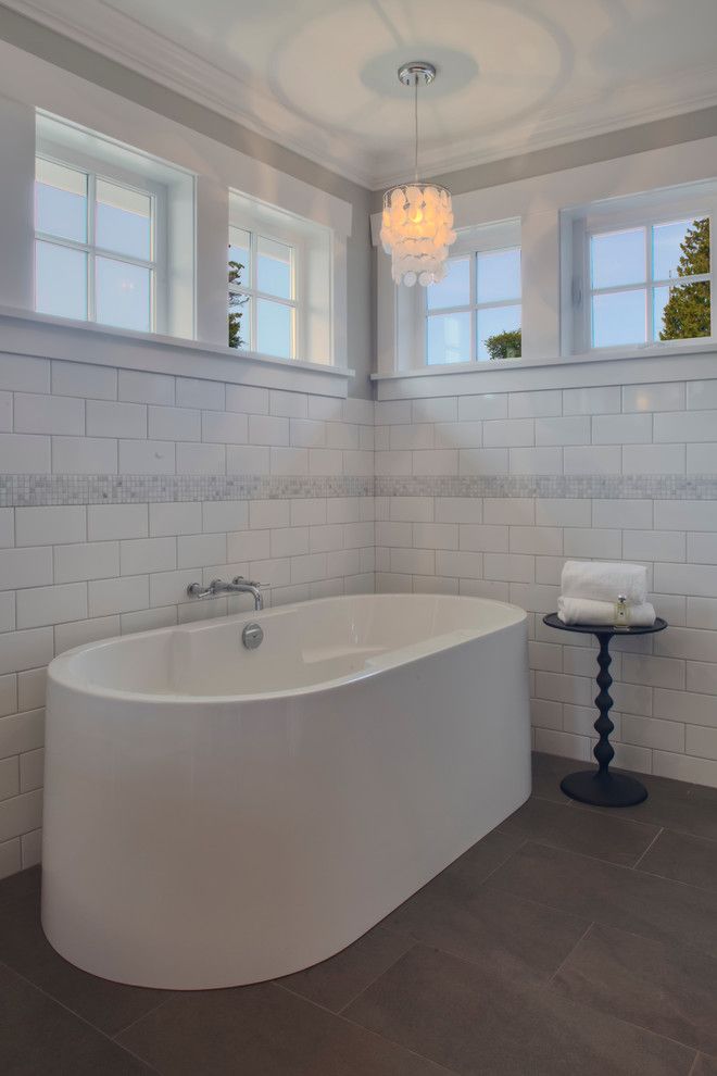 Grouting Tile for a Traditional Bathroom with a Bathtub and Qualicum Beach Residence by Richardson Homes Ltd