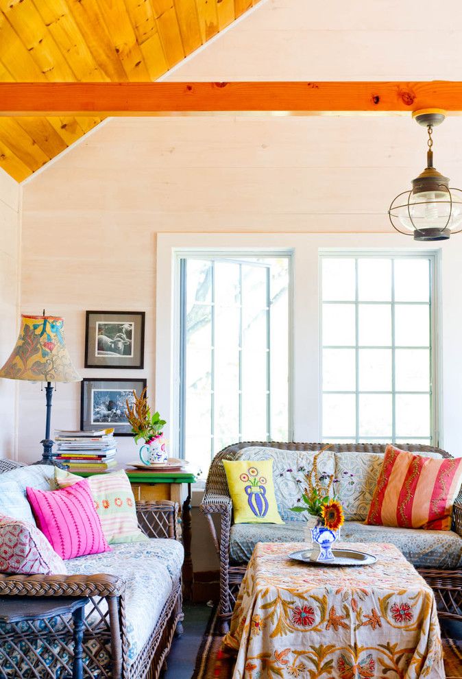 Hacienda Lighting for a Farmhouse Family Room with a Patterned Cushions and My Houzz: An Antique Cape Cod House Explodes with Color by Rikki Snyder