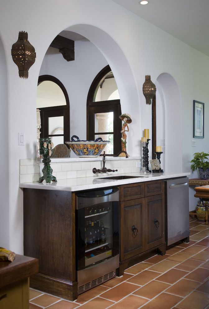 Hacienda Lighting for a Mediterranean Kitchen with a Wall Lighting and Hacienda Kitchen by Hann Builders