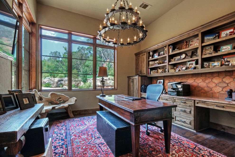 Hacienda Lighting for a Rustic Home Office with a Mediterranean and Lake Austin Hacienda by Rick O'donnell Architect