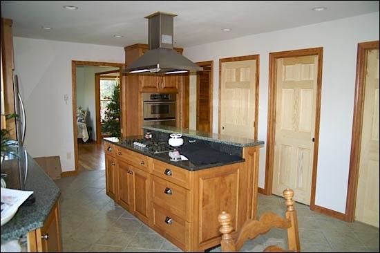 Hahn Appliance for a Traditional Kitchen with a Medium Wood Cabinets and Kitchens by Hahn Construction