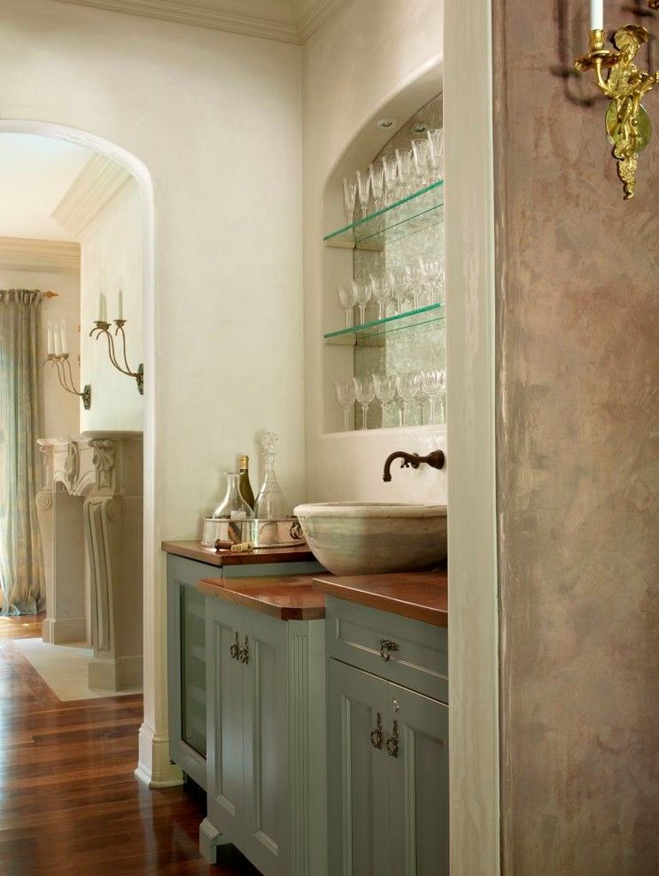 Handsome Cabinets for a Traditional Home Bar with a Stone Vessel and Simple Elegance by Glen Alspaugh Kitchens and Baths