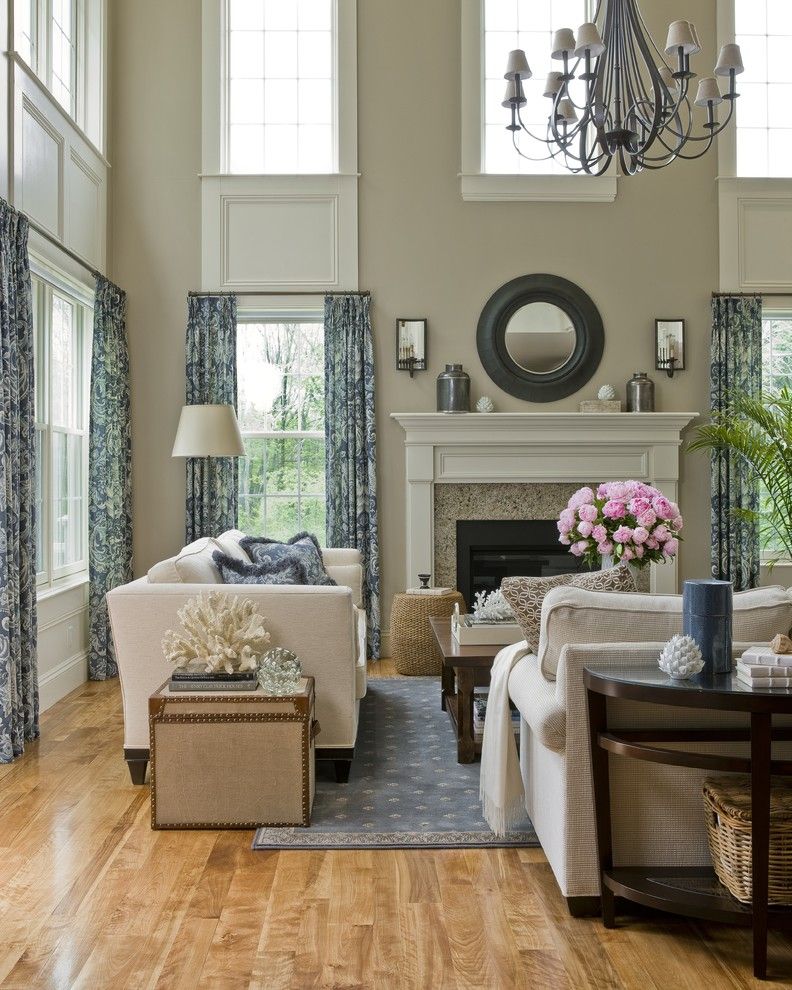 Hanks Furniture for a Traditional Living Room with a Beige Fireplace Mantel and Cathedral Living Room by Jtm Interiors, Llc