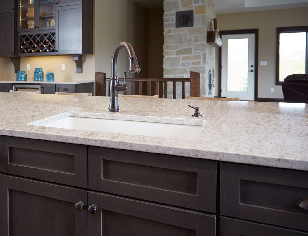 Hanstone for a Modern Kitchen with a Countertops and Oil Rubbed Bronze Faucet & Soap Dispenser by Gerhard's Kitchen & Bath Store