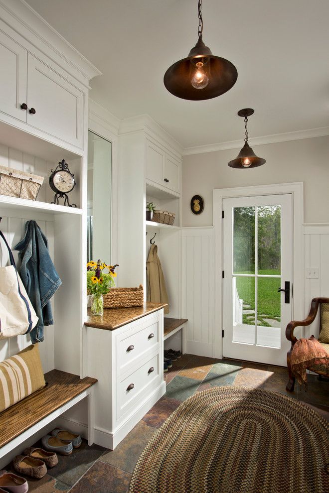 Hooks and Lattice for a Farmhouse Entry with a Cup Pulls and Farmhouse Vernacular by Teakwood Builders, Inc.