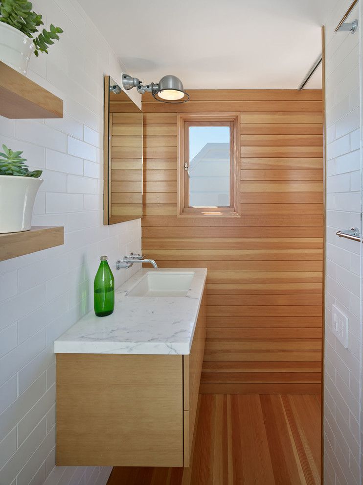 How to Clean Quartz Countertops for a Contemporary Bathroom with a Mirror and Master Suite Remodel by Neill and Lee Contractors