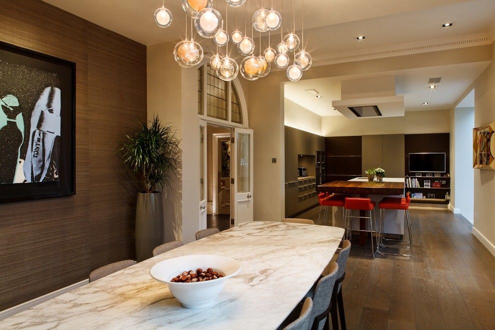 How to Dispose of Light Bulbs for a Contemporary Dining Room with a Lighting Design and a Custom Chandelier in the Dining Area by Brilliant Lighting