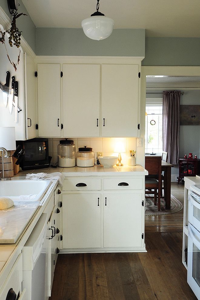 How to Organize Kitchen Cabinets for a Traditional Kitchen with a Schoolhouse Pendant and Through the Kitchen by Julie Smith