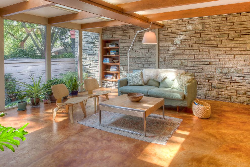 How to Stain Concrete Floors for a Midcentury Family Room with a Ceiling Beams and Christensen Remodeling by Genesis Architecture, Llc.