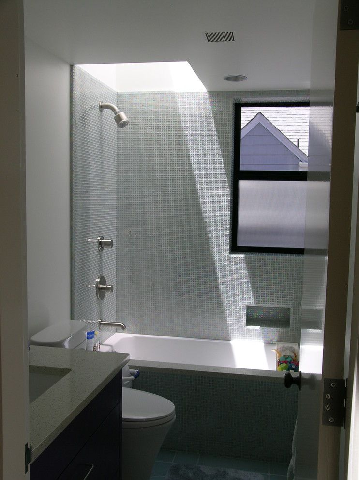 Icestone for a Contemporary Bathroom with a Skylight and Small Bathroom with Skylight by Cathy Schwabe Architecture