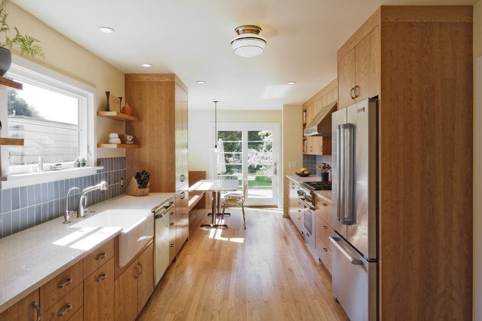 Icestone for a Transitional Kitchen with a Breakfast Nook and Wilshire Kitchen, Portland (Photo: Matt Niebuhr) by Howells Architecture + Design, Llc