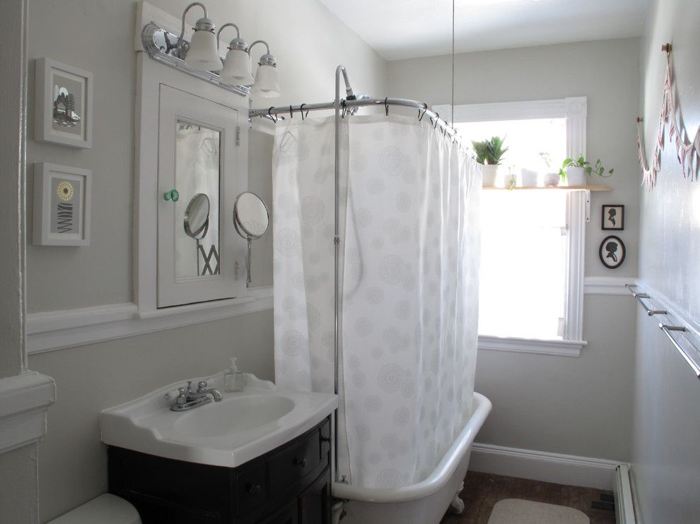 Ikea Besta Shelf for a Eclectic Bathroom with a Medicine Cabinet and Bath by the Red Jet