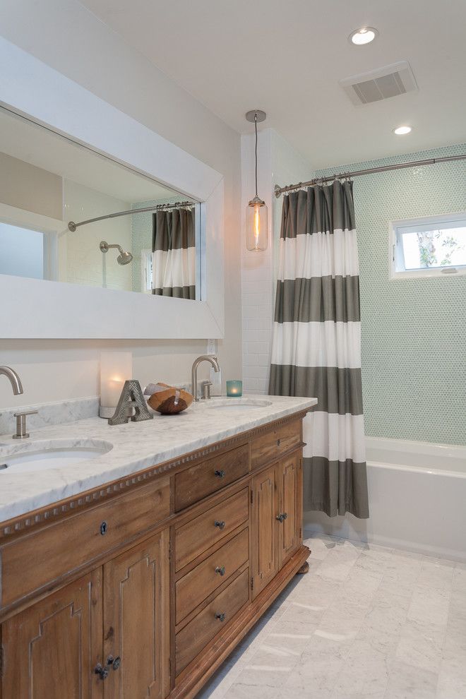 Ikea Curtain Rods for a Transitional Bathroom with a Tub and Balboa Coves Remodel by Eric Aust Architect