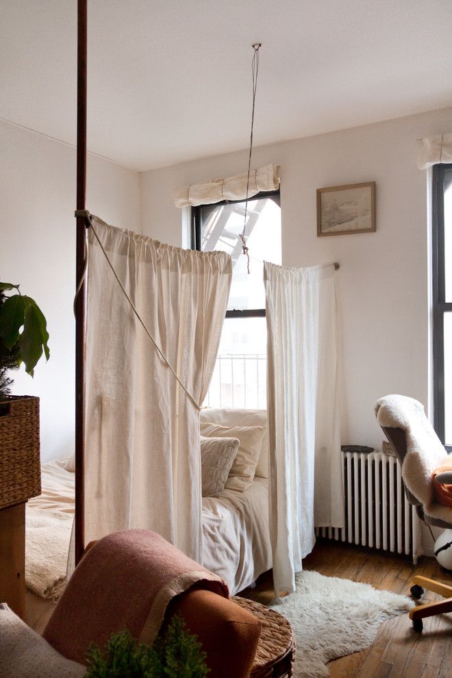 Ikea Panel Curtains for a Shabby Chic Style Bedroom with a Medium Hardwood Floor and My Houzz: Willa Kammerer by Rikki Snyder