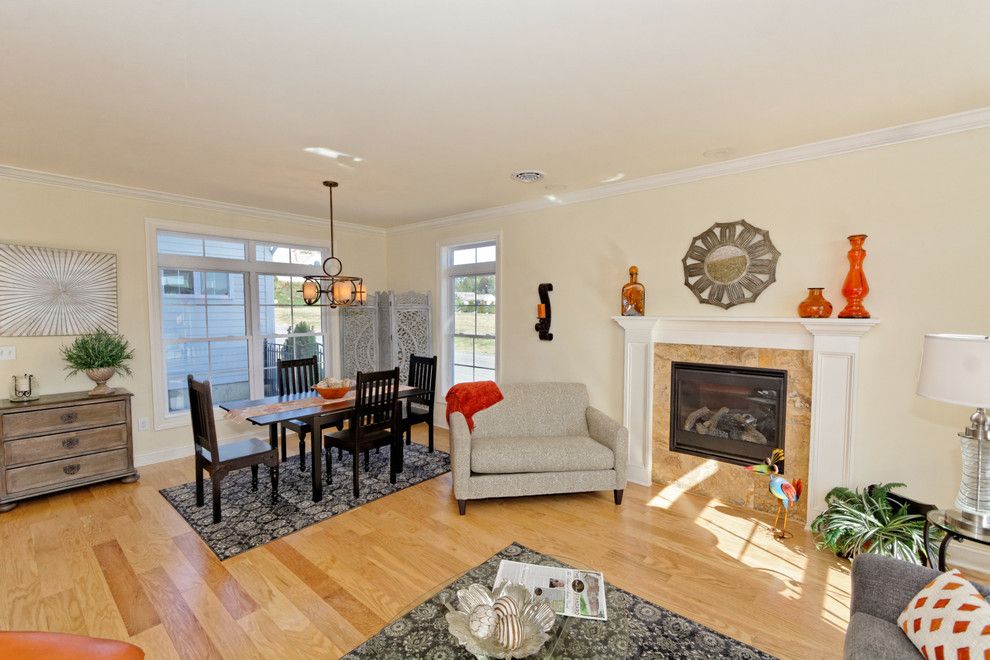 Ikea Swivel Chair for a Traditional Living Room with a Glass Top Coffee Table and Village at Shaker Creek by Viscusi Builders Ltd.