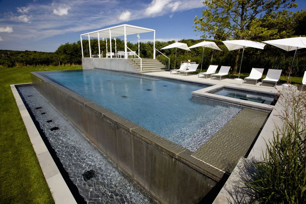 Infinity Edge Pool for a Contemporary Pool with a Riveria Marbledust and Infinity Edge Negative Edge Rimless Pools by J. Tortorella Swimming Pools