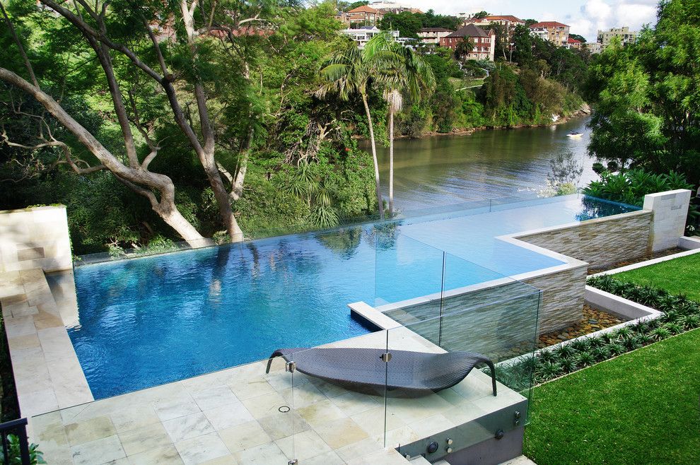 Infinity Edge Pool for a Contemporary Pool with a Trees and Shellcove by Peter Glass & Associates