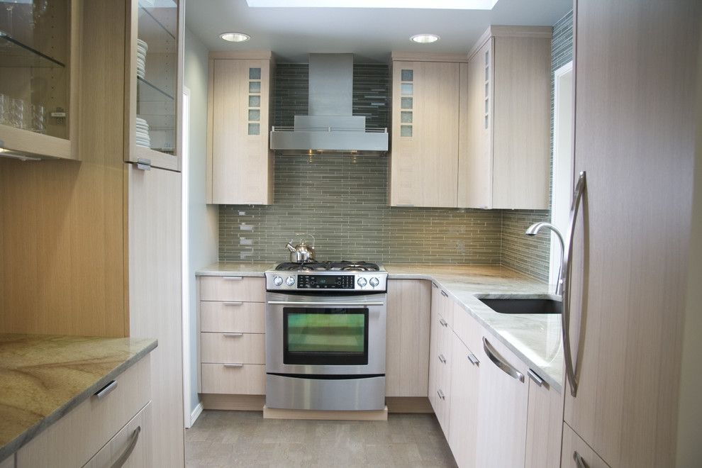 Installing Backsplash for a Contemporary Kitchen with a Panel Refrigerator and Small Contemporary Kitchen by Robin Rigby Fisher Cmkbd/caps