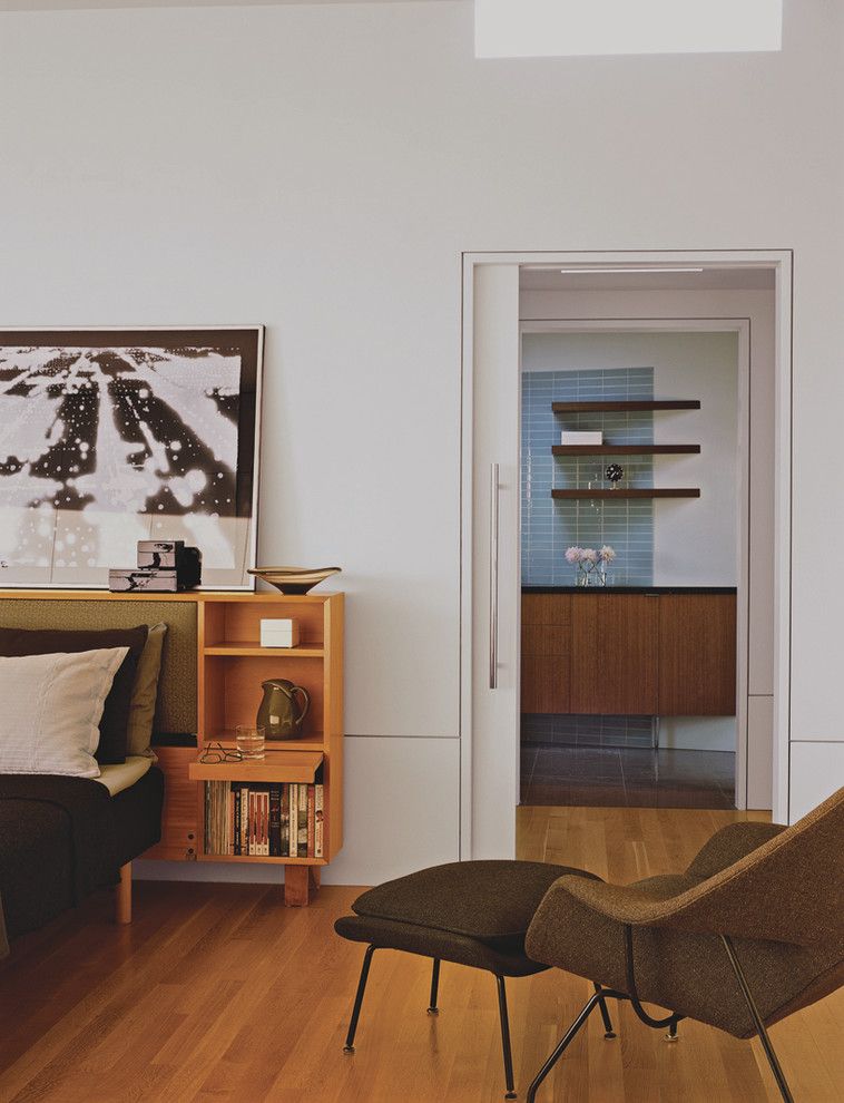 Installing Pocket Doors for a Midcentury Bedroom with a Wood Flooring and Master Bedroom by Laidlaw Schultz Architects