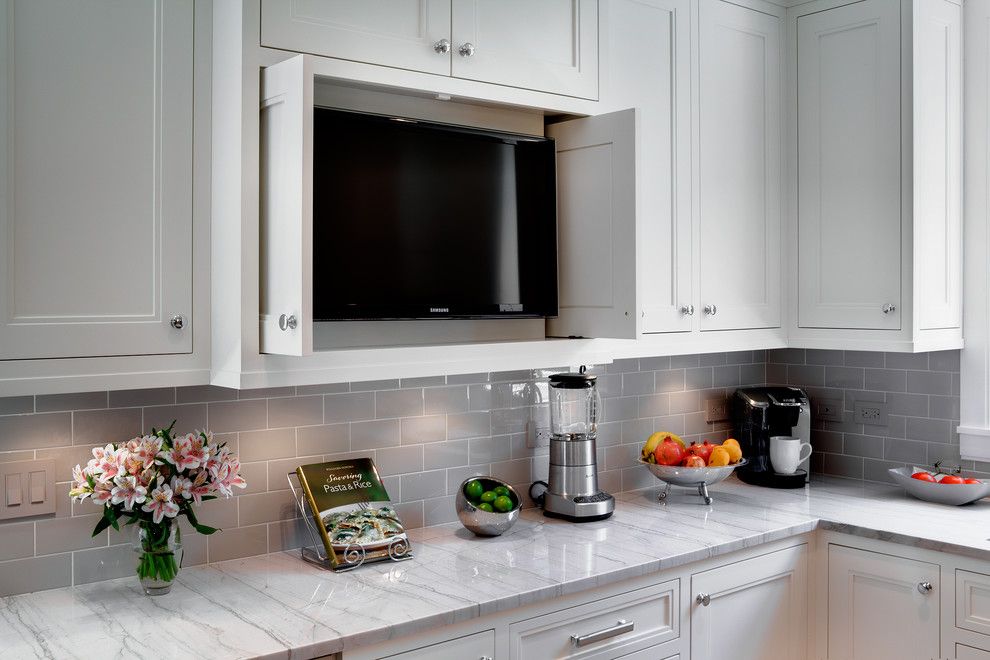 Installing Pocket Doors for a Traditional Kitchen with a Glass Subway Tile and Oak Park Kitchen by Tzs Design by Marcel Page Photography