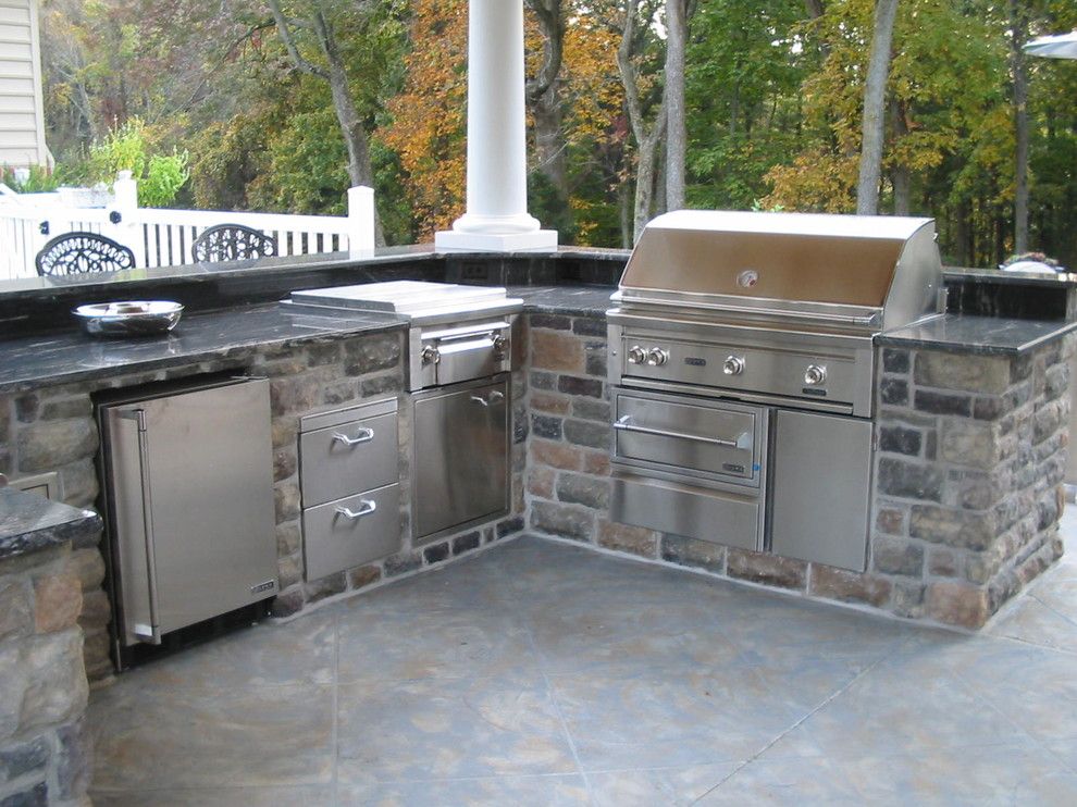 Ionic Columns for a Contemporary Patio with a Backyard Barbecue and Lynx Grills by Lynx Grills, Inc.