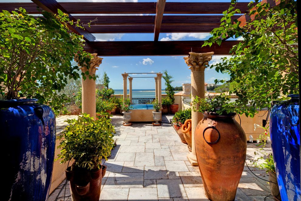 Ionic Columns for a Mediterranean Patio with a Corinthian Columns and 4011 Higel Siesta Key by Perrone Construction Custom Homes