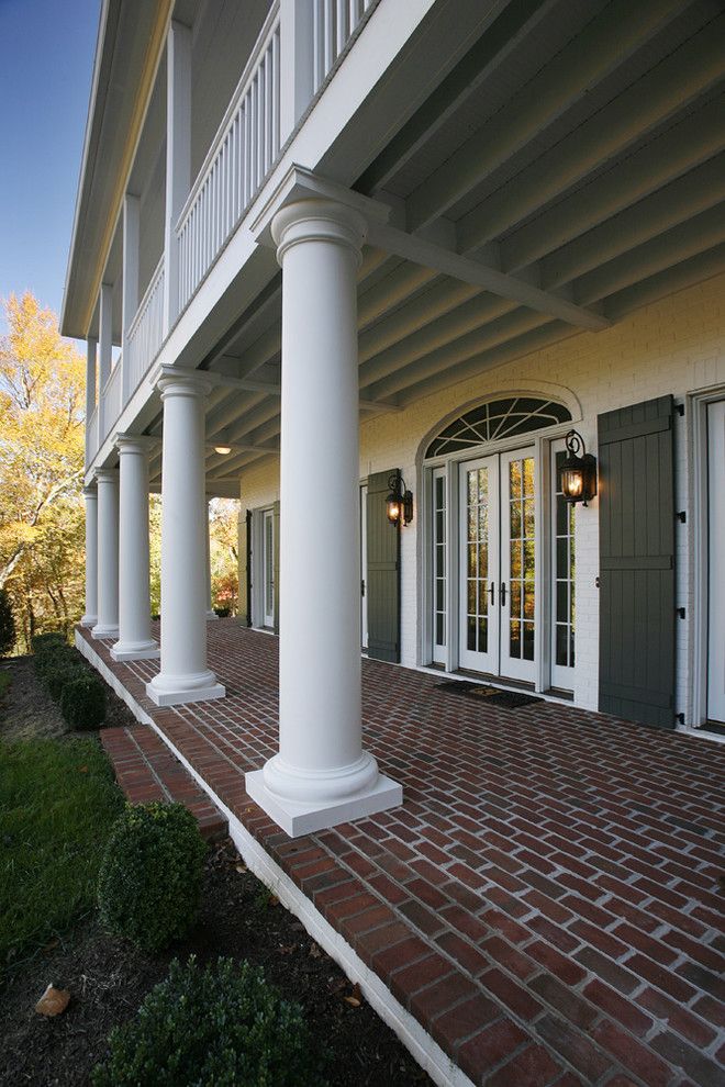 Ionic Columns for a Traditional Exterior with a French Colonial and French Colonial Residence by Jonathan Miller Architects