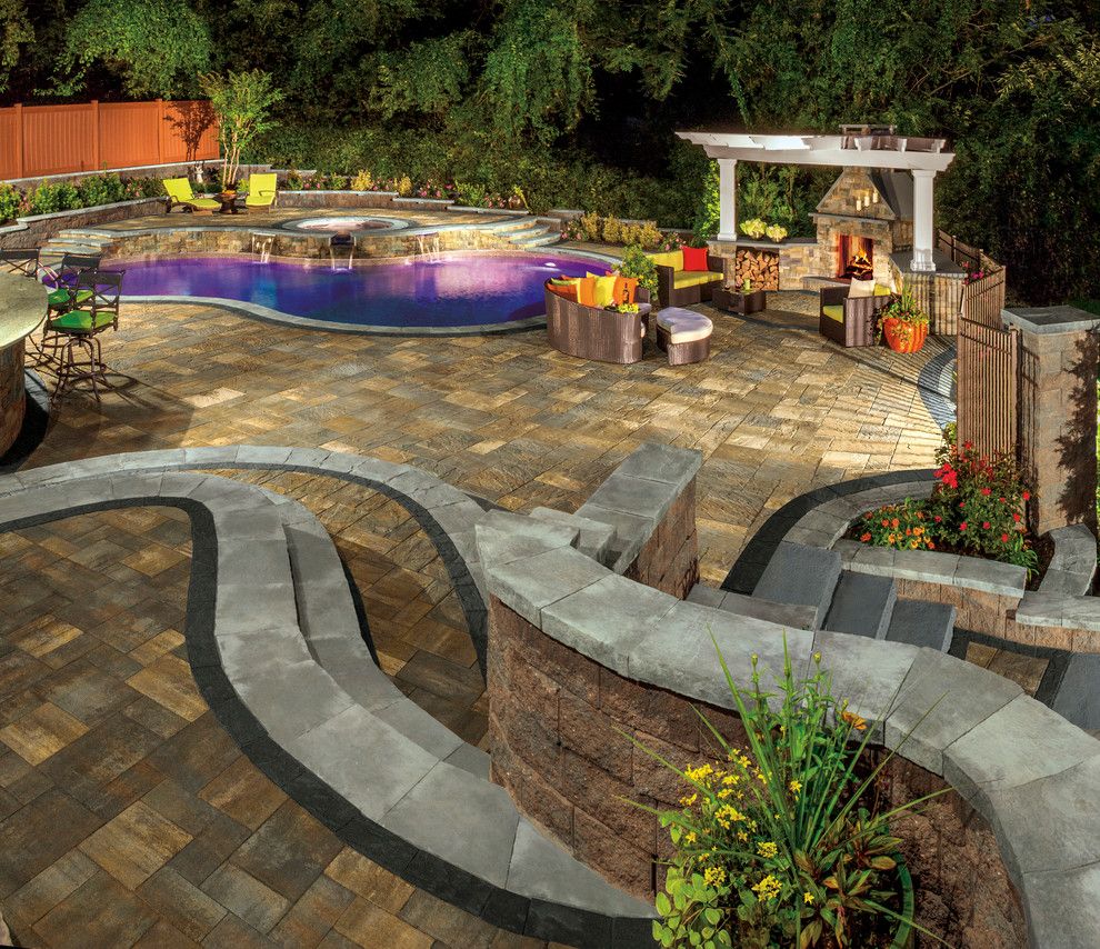 Islander Pools for a Contemporary Spaces with a Stone Patio and Cambridge Pavingstones with Armortec by Cambridge Pavingstones with Armortec